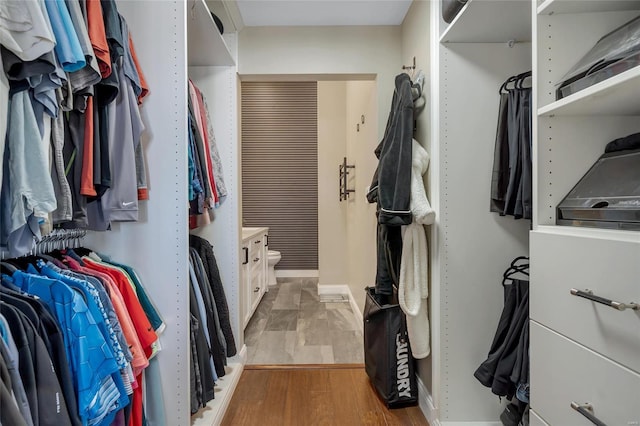 walk in closet featuring light wood-style floors