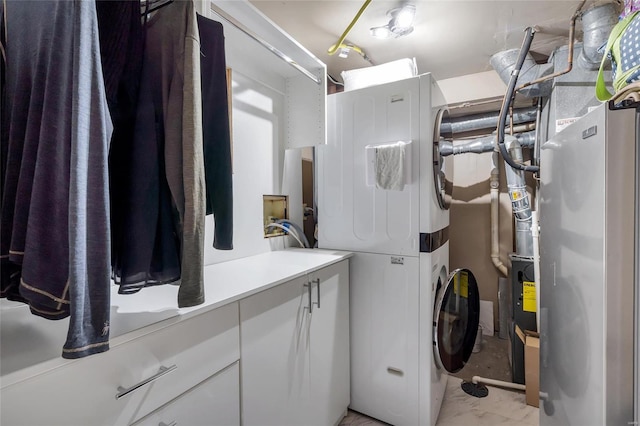 washroom featuring stacked washer / dryer