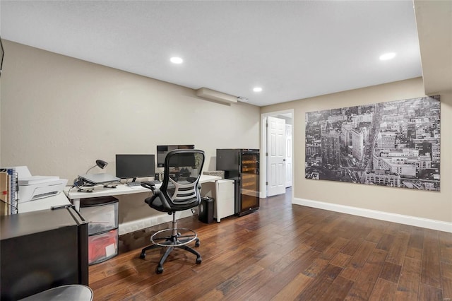 office area featuring beverage cooler, recessed lighting, wood finished floors, and baseboards