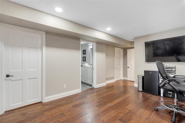 home office with dark wood finished floors, visible vents, recessed lighting, and baseboards