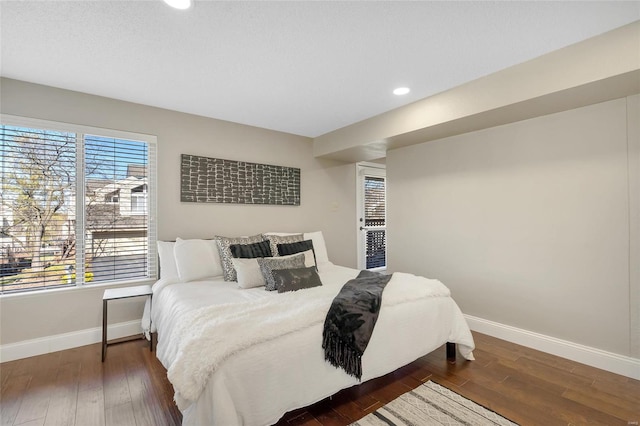 bedroom featuring recessed lighting, baseboards, and wood-type flooring