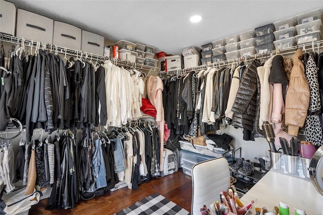 walk in closet featuring wood finished floors