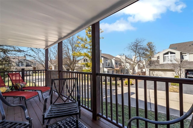 wooden terrace with a residential view