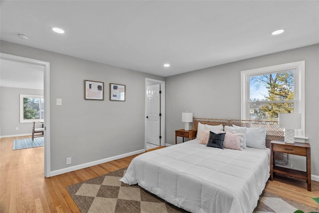 bedroom featuring recessed lighting, baseboards, and wood finished floors