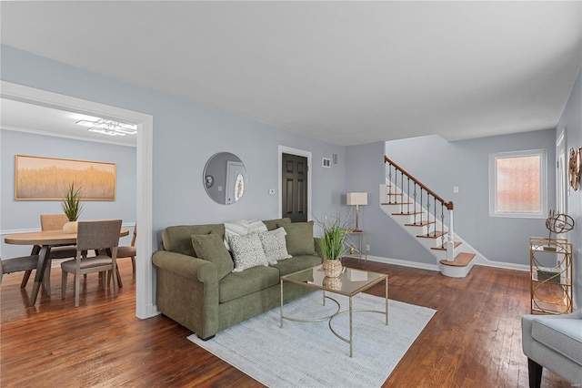 living room featuring stairway, baseboards, and dark wood-style flooring
