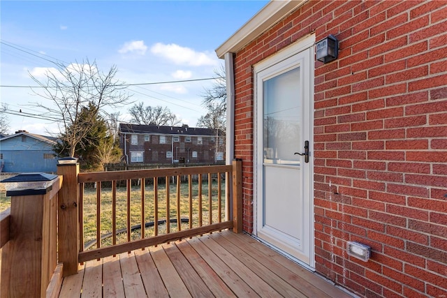 wooden deck with a residential view