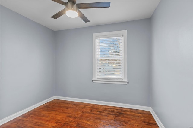 unfurnished room with ceiling fan, baseboards, and wood finished floors