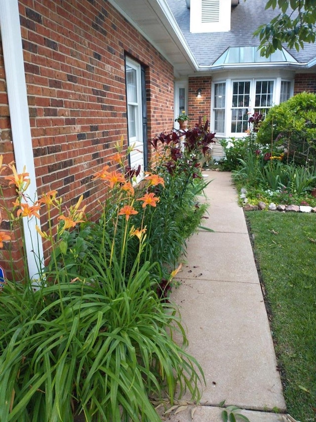 view of property exterior featuring brick siding