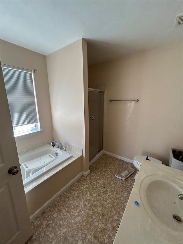 bathroom featuring a shower stall, baseboards, toilet, a bath, and a sink