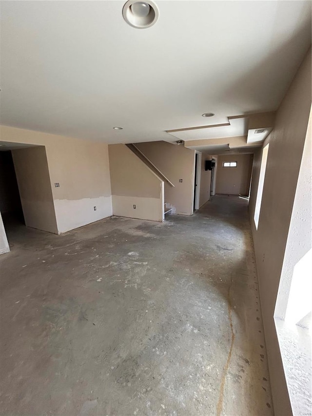 interior space with visible vents and unfinished concrete flooring