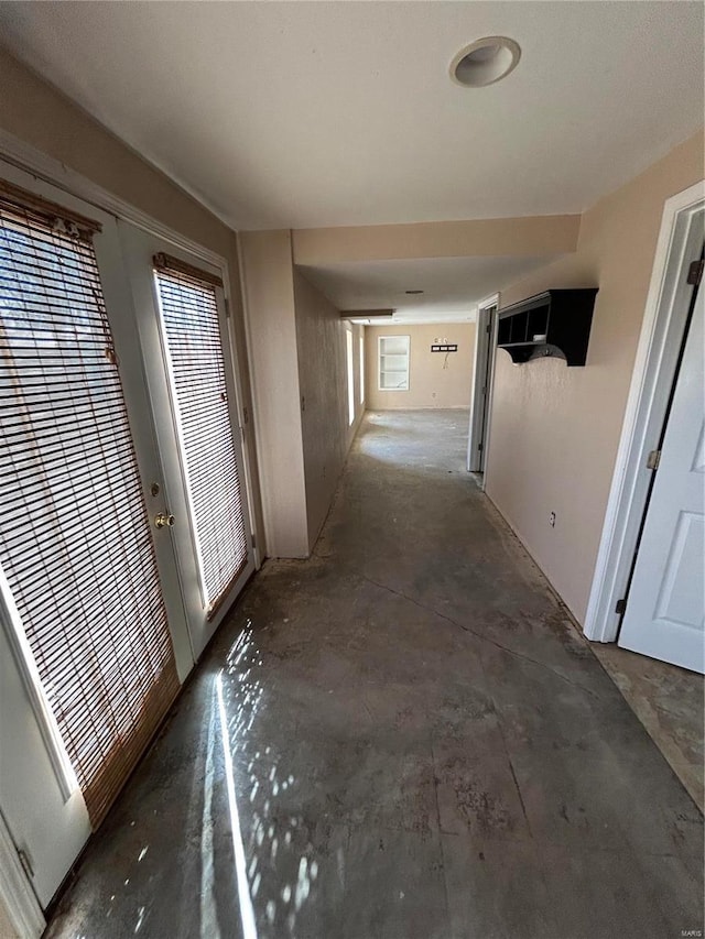 corridor featuring concrete flooring