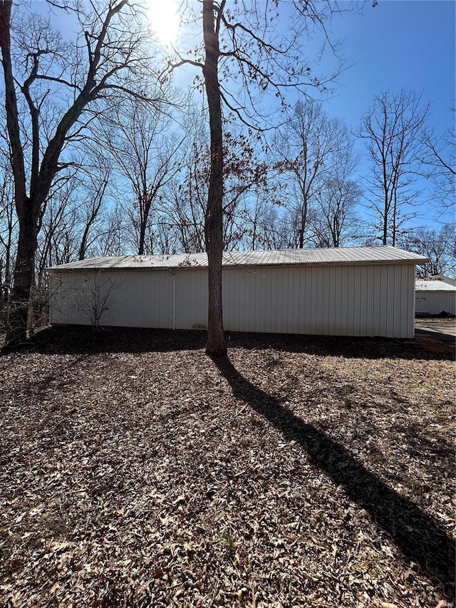 view of yard with an outbuilding and a pole building