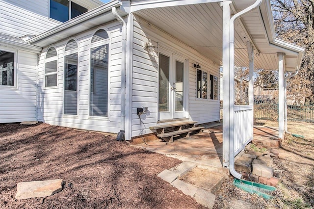 view of side of property with entry steps