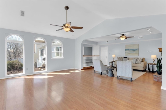 unfurnished living room featuring visible vents, light wood-style floors, and a ceiling fan