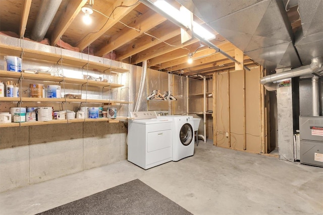 unfinished below grade area with washing machine and dryer