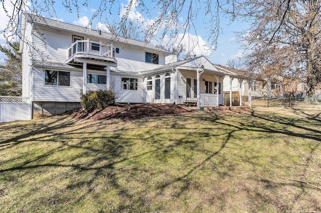 back of house with a yard, a porch, and fence