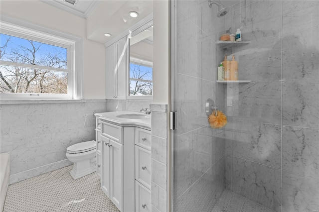 bathroom with vanity, plenty of natural light, and a stall shower