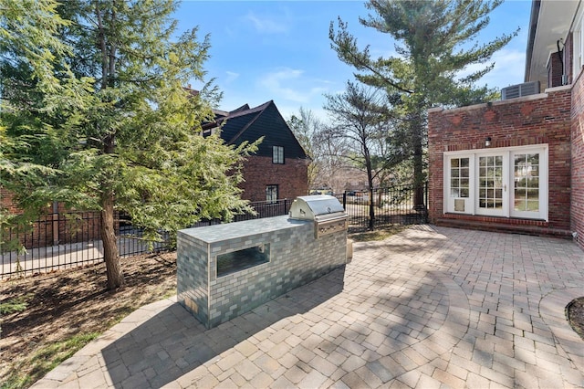 view of patio featuring grilling area, fence, and area for grilling