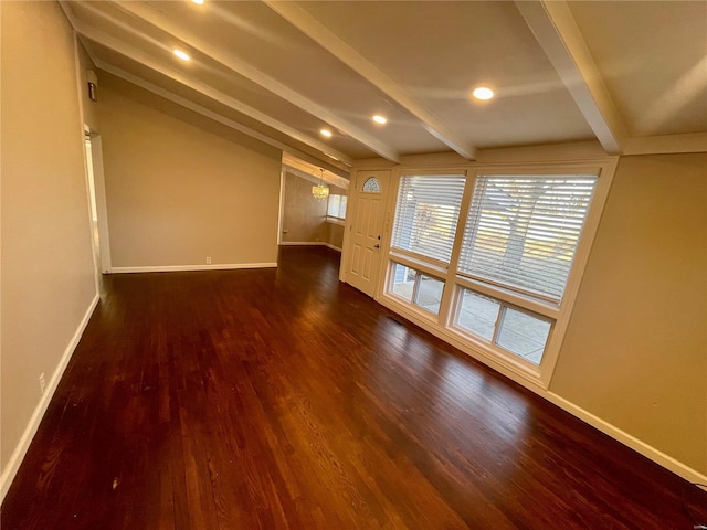 empty room featuring dark wood-type flooring, beamed ceiling, recessed lighting, and baseboards