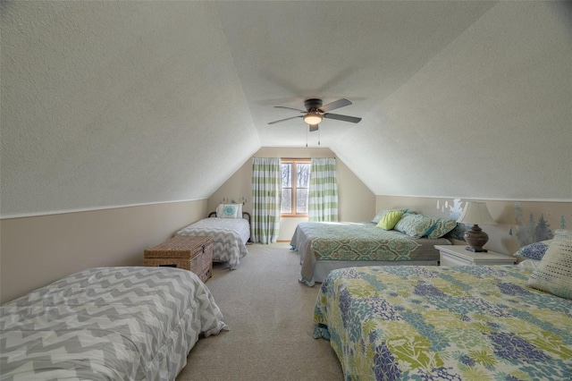 carpeted bedroom featuring a textured ceiling, a ceiling fan, and vaulted ceiling