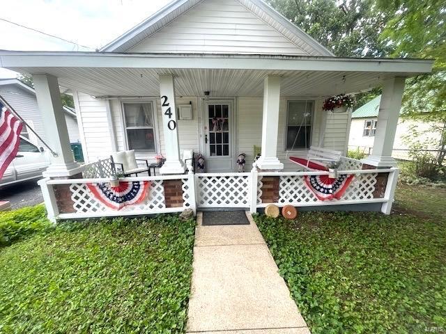 entrance to property with a porch