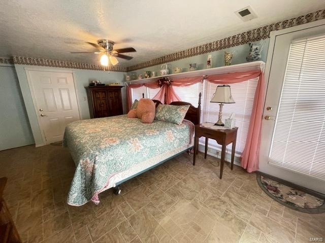 bedroom featuring visible vents and ceiling fan