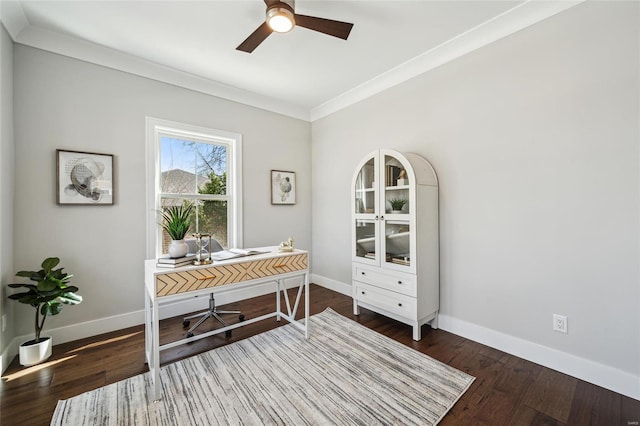 office space featuring ornamental molding, a ceiling fan, baseboards, and wood finished floors