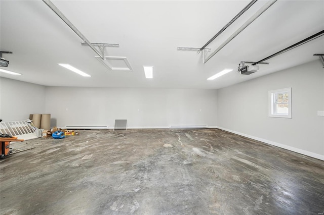 garage featuring baseboard heating, a garage door opener, a baseboard heating unit, and baseboards