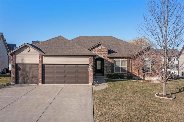 single story home featuring brick siding, an attached garage, concrete driveway, and a front yard