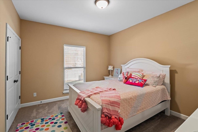 carpeted bedroom featuring baseboards