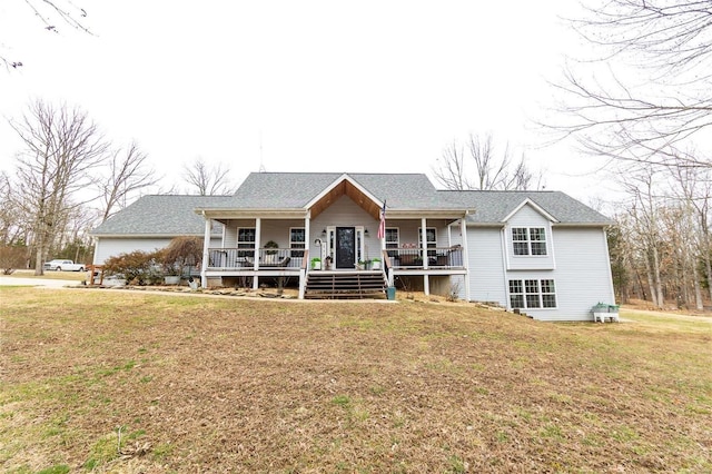 single story home with covered porch and a front yard