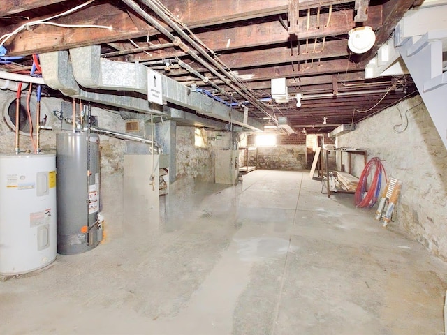 unfinished below grade area with water heater and electric water heater