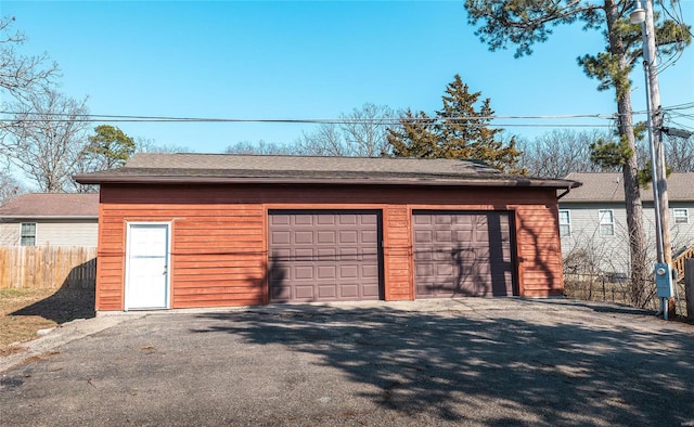 garage featuring fence