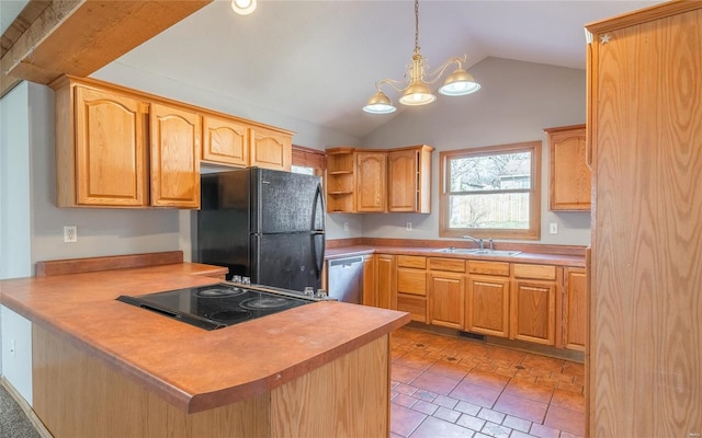 kitchen with dishwasher, a peninsula, freestanding refrigerator, a notable chandelier, and a sink