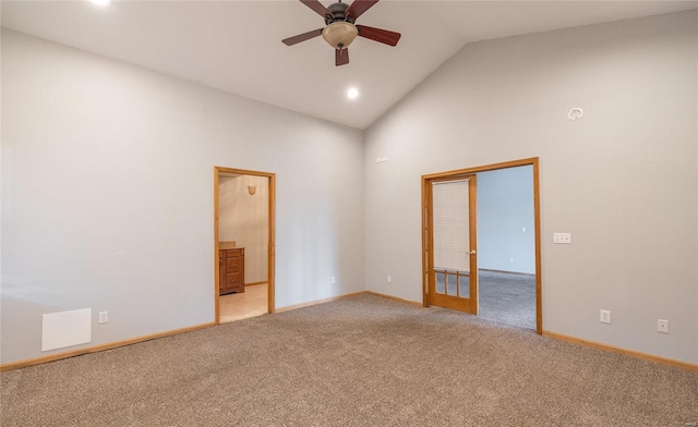 spare room with baseboards, ceiling fan, light carpet, recessed lighting, and high vaulted ceiling