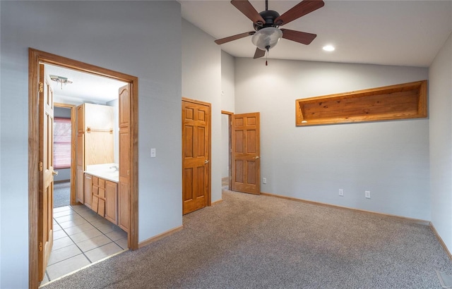 unfurnished bedroom featuring light carpet, recessed lighting, baseboards, and lofted ceiling