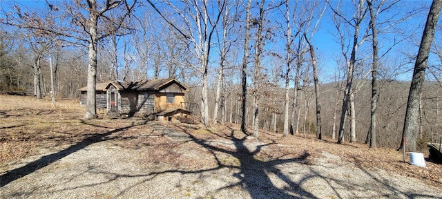 view of yard with a wooded view