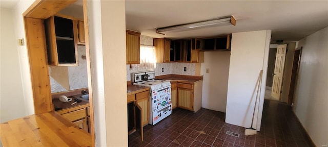 kitchen with visible vents, backsplash, and white range with electric stovetop