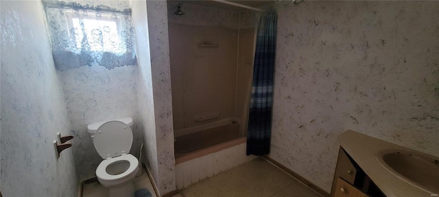 bathroom featuring tile patterned flooring, wallpapered walls, toilet, shower / tub combo with curtain, and vanity