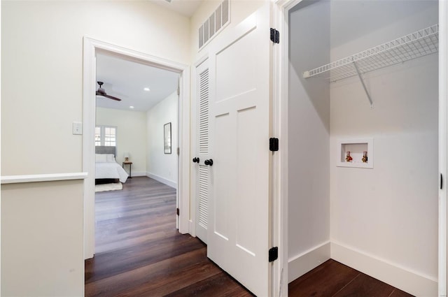 laundry area with hookup for a washing machine, baseboards, visible vents, laundry area, and dark wood-style flooring