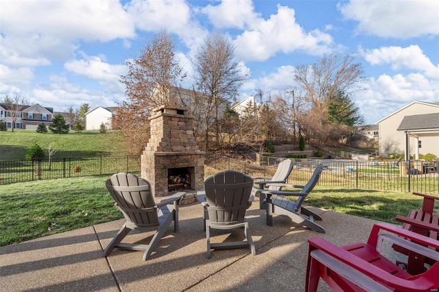 view of patio / terrace featuring an outdoor stone fireplace and fence