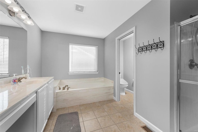 bathroom with visible vents, toilet, a shower stall, and tile patterned flooring