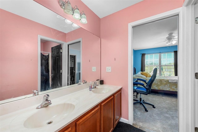 ensuite bathroom with double vanity, ensuite bathroom, and a sink