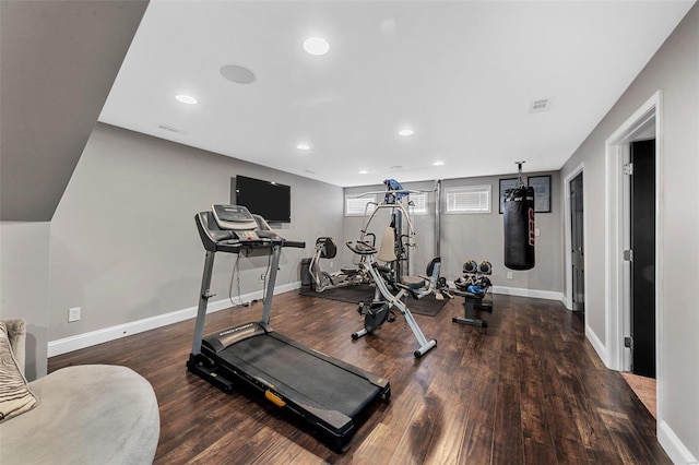 workout area with recessed lighting, visible vents, baseboards, and wood finished floors