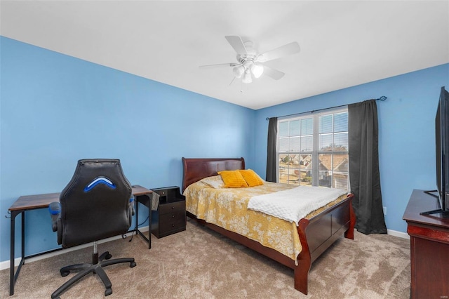 bedroom featuring baseboards, a ceiling fan, and carpet flooring