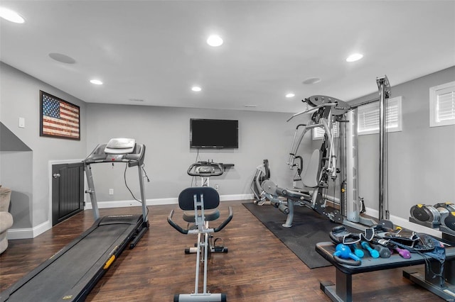 workout area featuring recessed lighting, wood finished floors, and baseboards