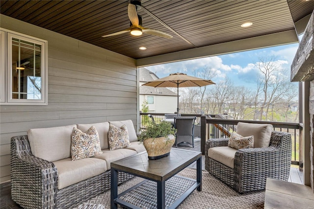 exterior space featuring an outdoor hangout area and a ceiling fan