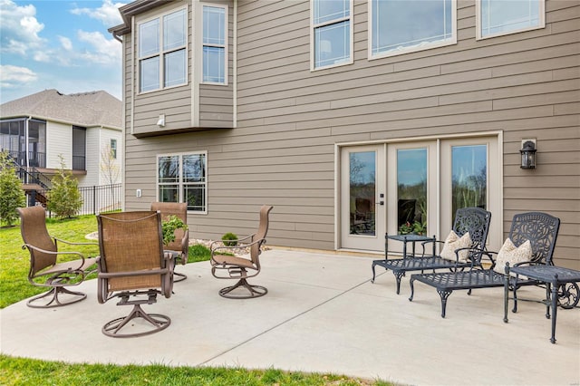 exterior space featuring fence and french doors