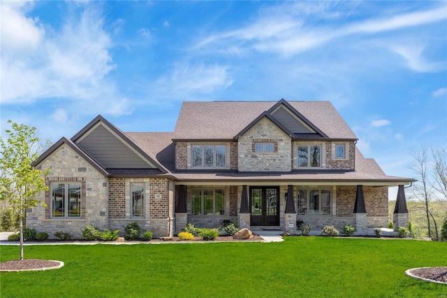 craftsman house featuring covered porch, stone siding, roof with shingles, french doors, and a front lawn