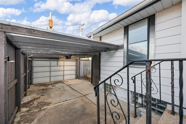 garage with a carport and a garage door opener